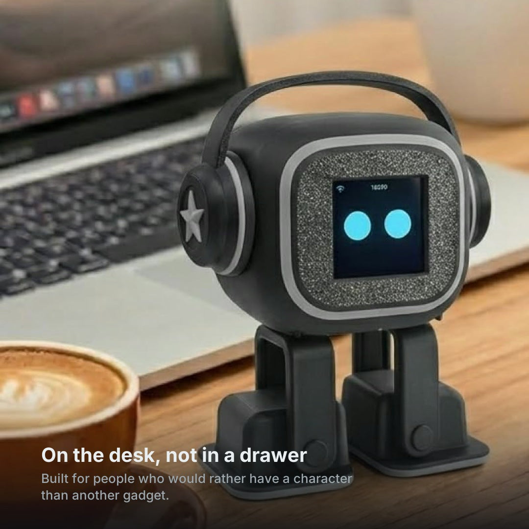 Miso standing on a work desk beside a laptop and a cup of coffee
