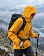 Sunny Orange | CAMEL membrane jacket on a mountain trail in the rain